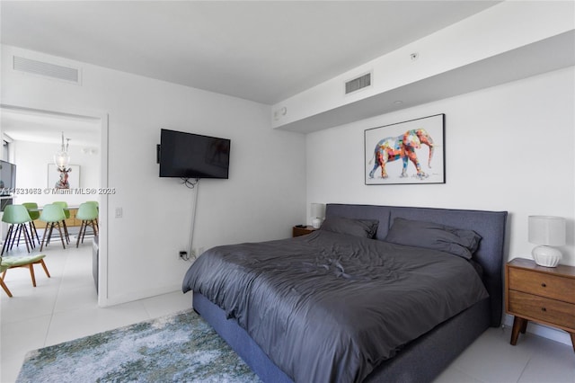 bedroom with light tile patterned floors