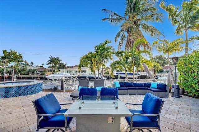 view of patio with an in ground hot tub and outdoor lounge area