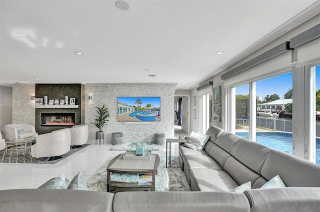 tiled living room featuring a large fireplace