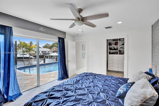 carpeted bedroom featuring access to exterior and ceiling fan