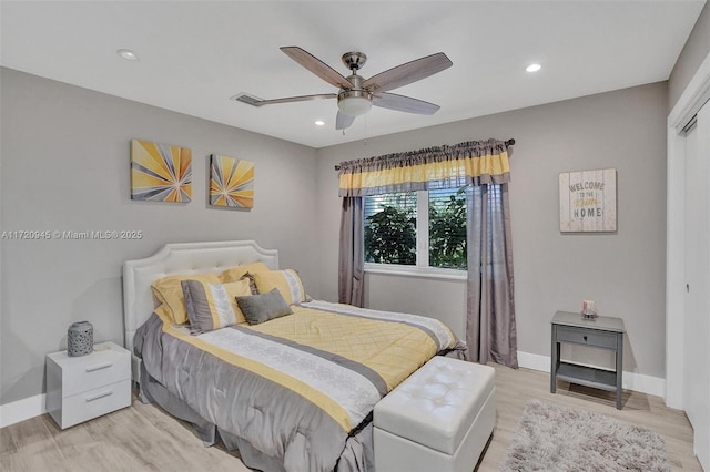 bedroom featuring ceiling fan and light hardwood / wood-style flooring