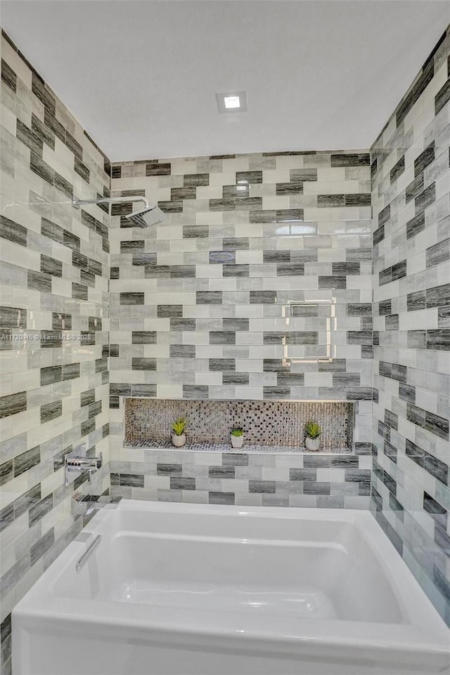 bathroom featuring a washtub