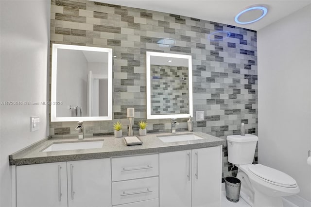 bathroom with vanity, decorative backsplash, and tile walls