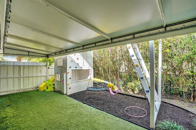 view of outbuilding featuring a lawn