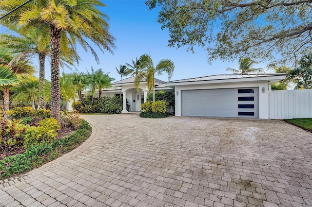 single story home featuring a garage