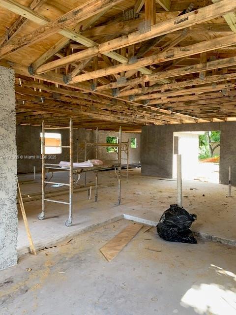 miscellaneous room featuring lofted ceiling