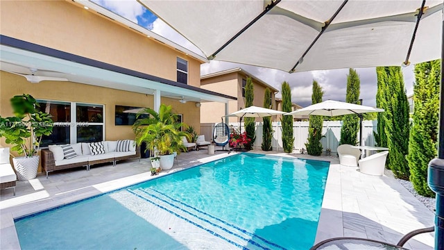 view of swimming pool with outdoor lounge area and a patio