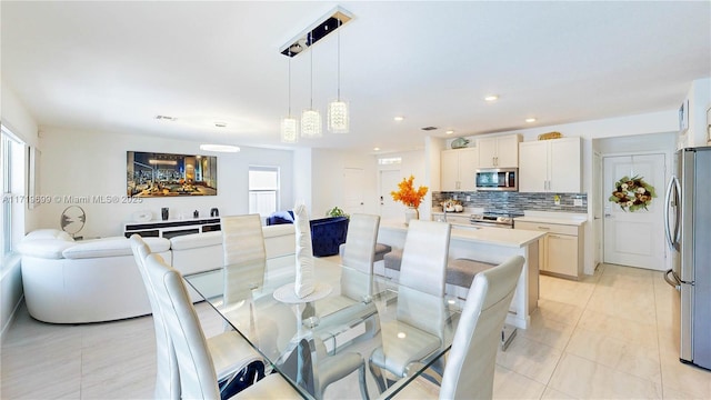 dining room with light tile patterned flooring