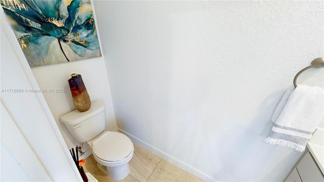 bathroom featuring tile patterned floors and toilet