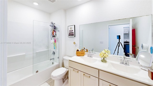 full bathroom featuring vanity, bathing tub / shower combination, and toilet