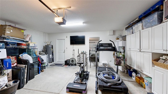 exercise room with water heater and a textured ceiling