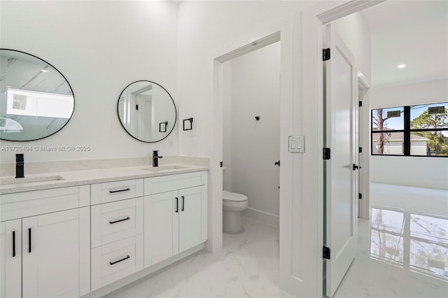 bathroom with vanity and toilet