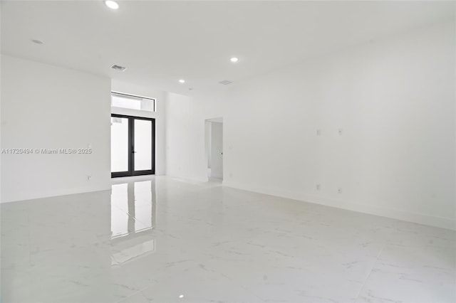 empty room featuring french doors