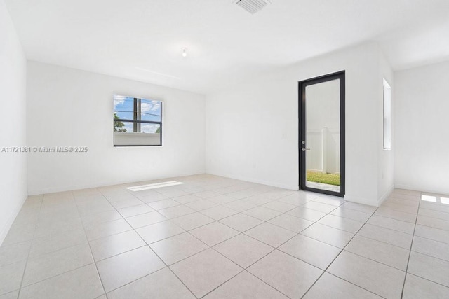 spare room with light tile patterned floors