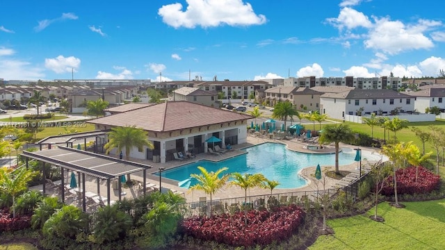 view of swimming pool with a patio area and a pergola