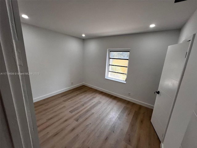 unfurnished room with light hardwood / wood-style flooring