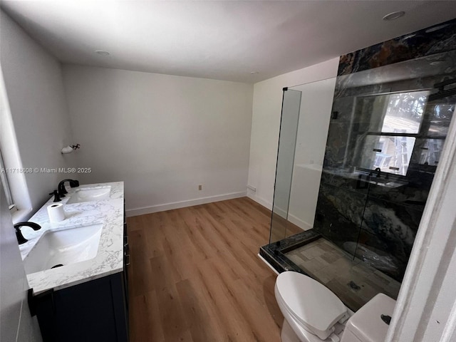 bathroom featuring hardwood / wood-style flooring, vanity, toilet, and an enclosed shower