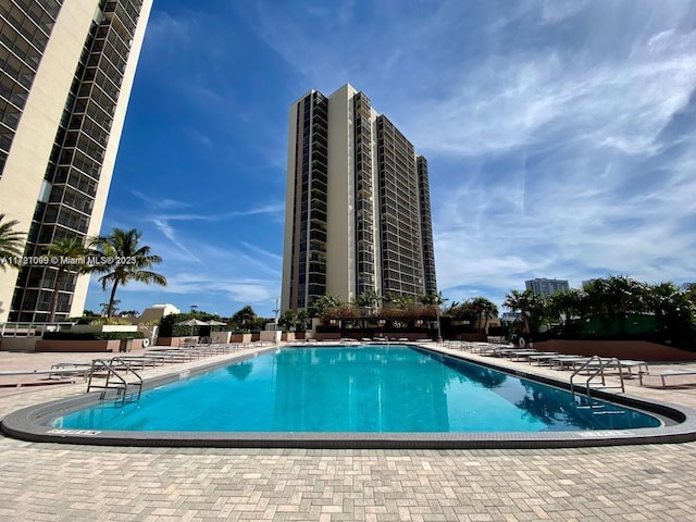 view of pool featuring a patio