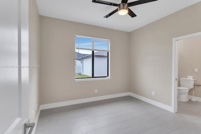 unfurnished bedroom featuring ensuite bath and ceiling fan