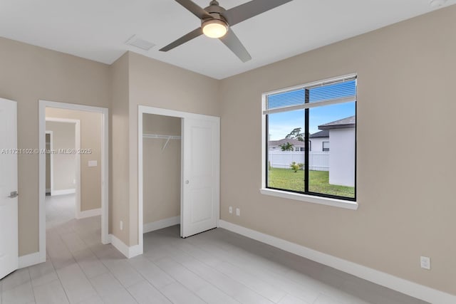 unfurnished bedroom featuring a closet and ceiling fan