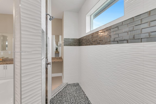 interior space featuring tiled shower