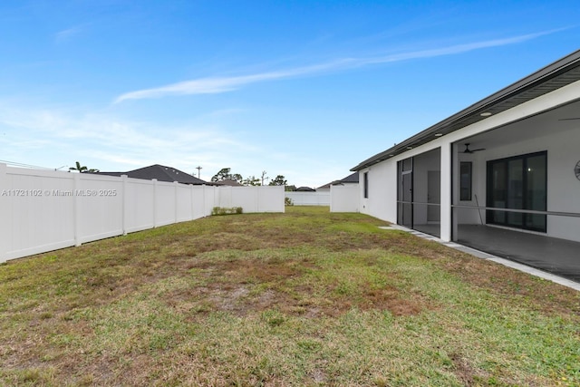 view of yard featuring ceiling fan