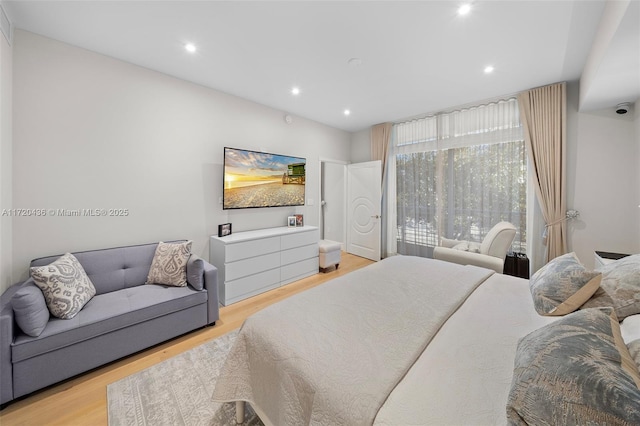 bedroom with light hardwood / wood-style flooring