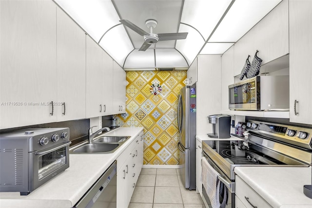 kitchen with white cabinetry, sink, and appliances with stainless steel finishes