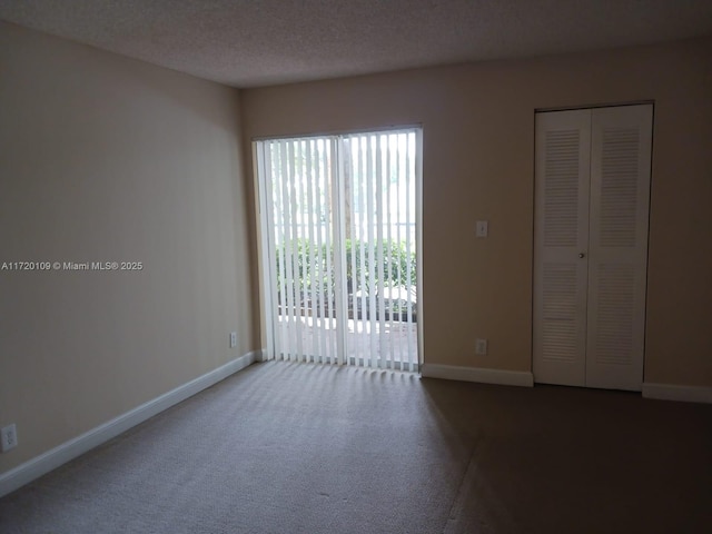 empty room with a textured ceiling