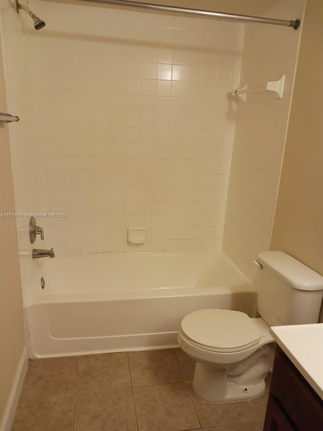 full bathroom featuring tile patterned floors, vanity, toilet, and tiled shower / bath combo