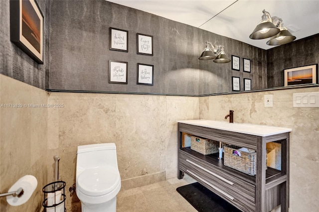2877 NE 29th St, Fort Lauderdale, FL 33306 - bathroom featuring tile walls, toilet, tile patterned floors, and vanity
