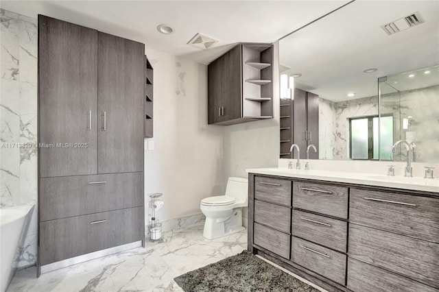 bathroom featuring a bathtub, vanity, and toilet