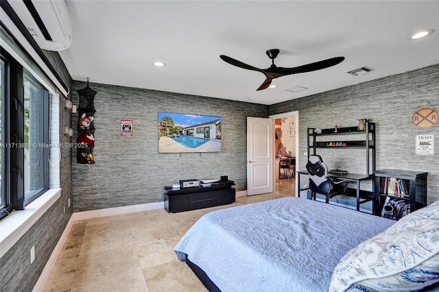 unfurnished bedroom featuring a wall mounted AC and ceiling fan