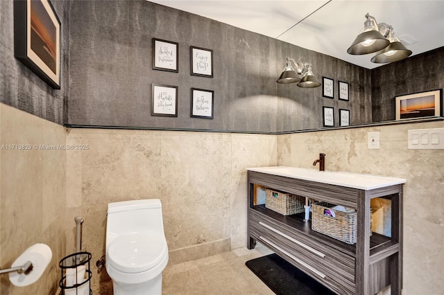 bathroom featuring tile patterned floors, vanity, and toilet