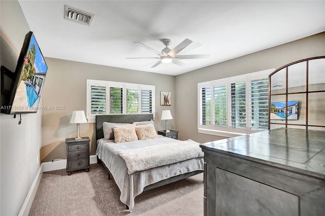 bedroom with light carpet and ceiling fan