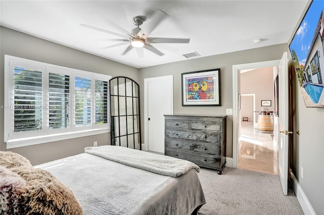 carpeted bedroom with ceiling fan