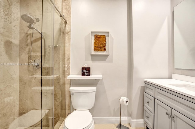 bathroom with vanity, a shower with shower door, and toilet