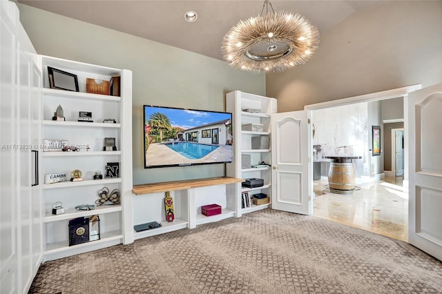 living room featuring lofted ceiling and an inviting chandelier