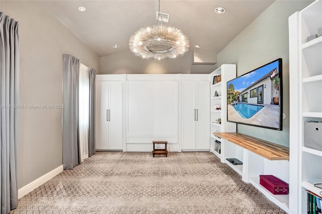 interior space featuring a chandelier, light carpet, and vaulted ceiling