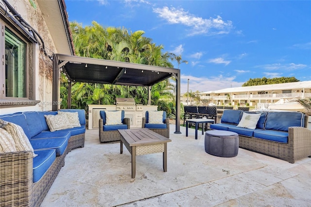 view of patio featuring exterior kitchen, a grill, and an outdoor hangout area