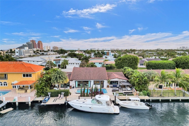 birds eye view of property with a water view