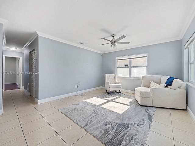 living room featuring ceiling fan, light tile patterned floors, and ornamental molding