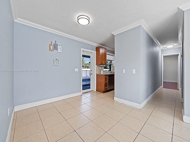 tiled spare room with crown molding