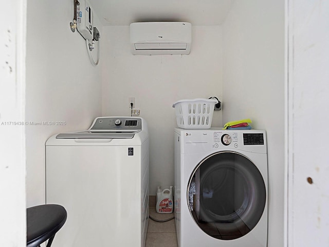 laundry area featuring washer and dryer, tile patterned floors, and an AC wall unit