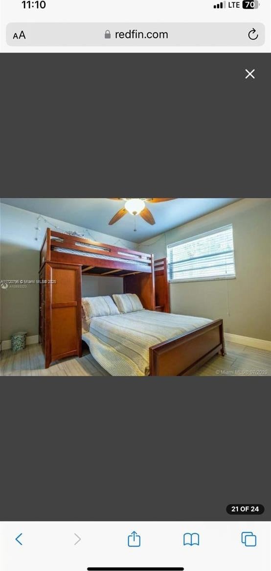 bedroom featuring light hardwood / wood-style floors and ceiling fan