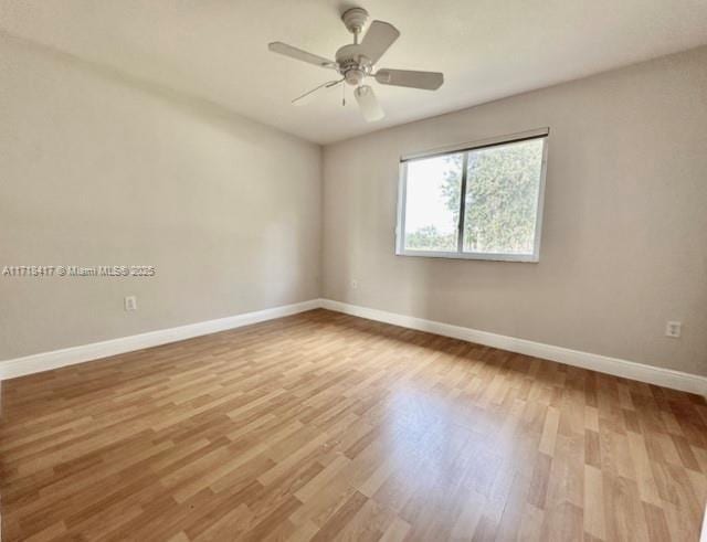 empty room featuring light hardwood / wood-style flooring and ceiling fan