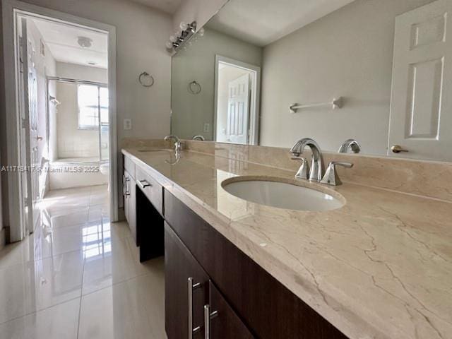 bathroom featuring tile patterned floors, vanity, toilet, and walk in shower