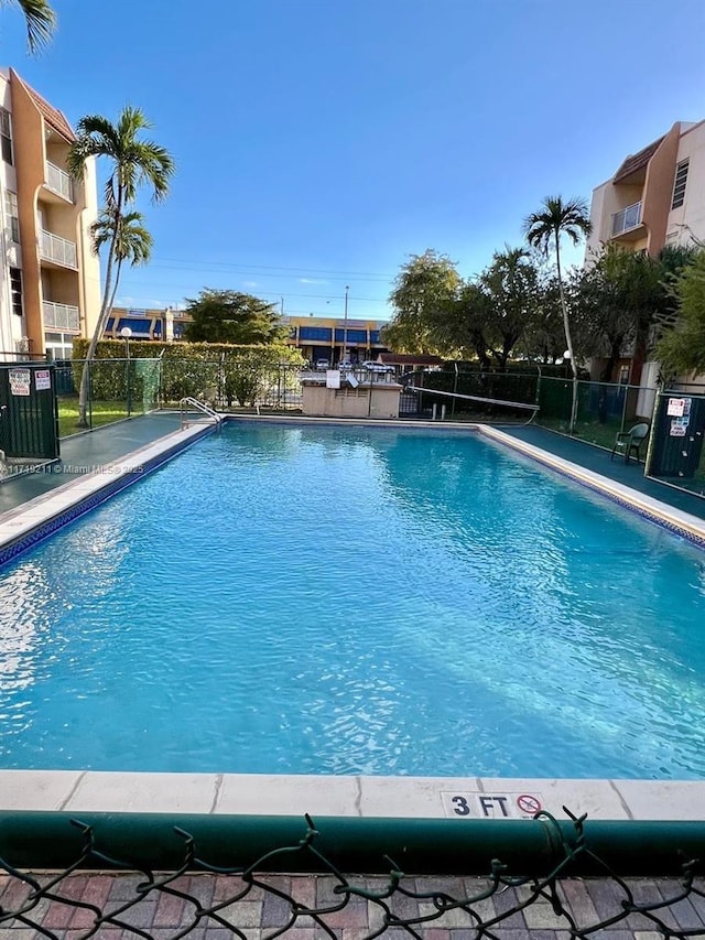 view of swimming pool featuring central air condition unit