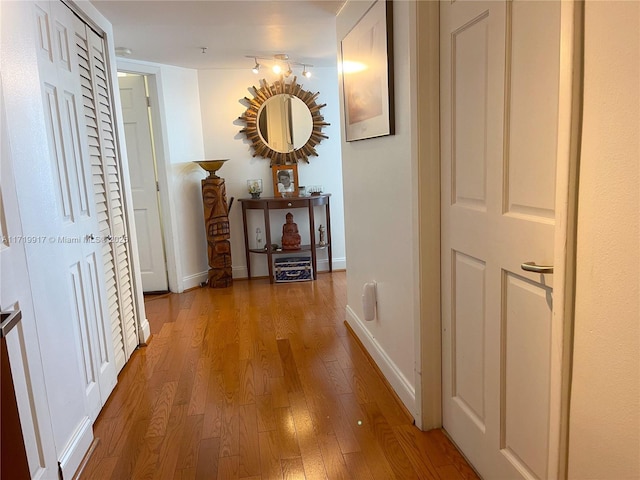 corridor featuring hardwood / wood-style flooring