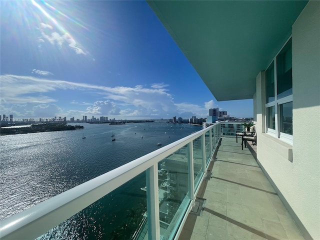 balcony featuring a water view